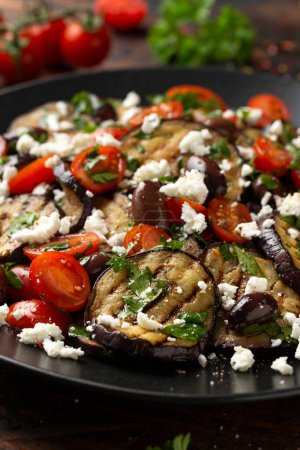 Photo for Roasted Eggplant, Tomato salad with kalamata olives and Feta cheese. - Royalty Free Image