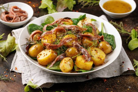 Photo for Warm salad with anchovy and baby potatoes and wholegrain mustard. - Royalty Free Image