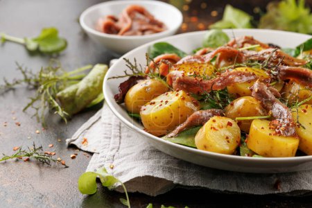 Photo for Warm salad with anchovy and baby potatoes and wholegrain mustard. - Royalty Free Image