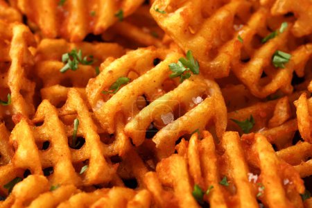 Crisscross potato lattices, golden waffle fries with sea salt and parsley.