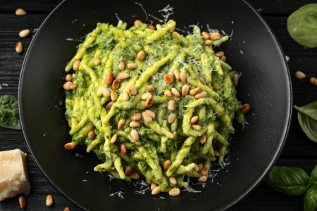 Trofie pasta with creamy spinach sauce and toasted pine nuts.