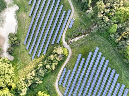 Aerial view of solar panels at a solar farm set amongst the countryside