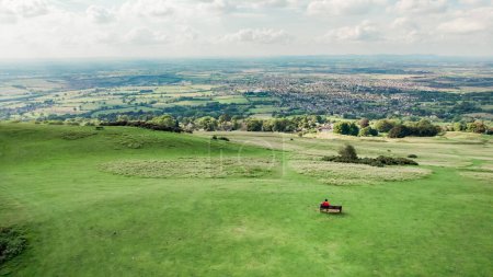 Photo for Backpack hiker on Cleeve Hill, Cheltenham, Gloucestershire, England, Summer daytime - Royalty Free Image