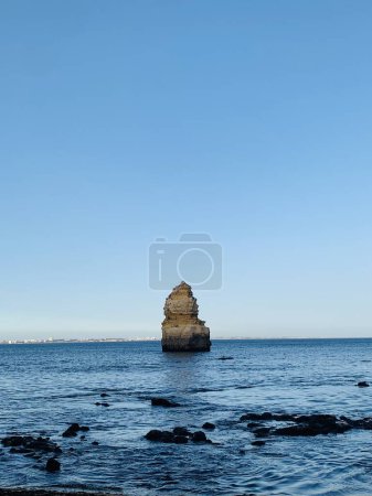 Photo for Rocky coastline, Ponta da Piedade Lighthouse at the end of Cape Sao Goncalo de Lagos, in the Algarve region, Portugal. travel destination concept - Royalty Free Image
