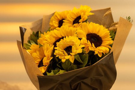 Photo for A beautiful bouquet of sunflowers stands in a vase . Bouquet for birthday , wedding ,in rustic style. copy space. Selective focus . Horizontal photo. - Royalty Free Image
