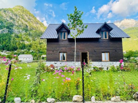 Photo for Beautiful guest house in the valley of Theth national park, Albania. Albanian alps. Traditional style of the house in northern Albania and also in Balkan alps, Travel destination , - Royalty Free Image