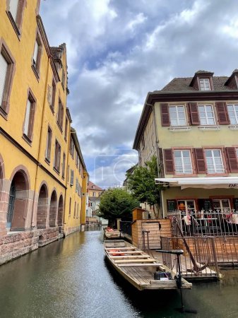 Photo for Urban medieval landscape of Alsace, water canal and traditional half timbered houses located in Colmar, France. Travel destination concept. Vertical Photo . - Royalty Free Image