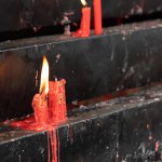Red Candles Lighting up in Temple for Worship