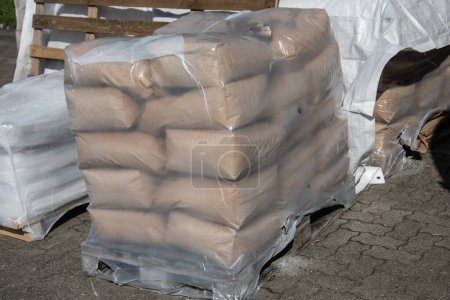 Bags of cement on a pallet at the construction site