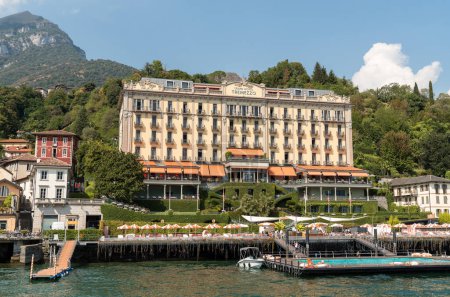 Photo for Tremezzina, Lombardy, Italy - September 5, 2022: View of the Luxury Grand Hotel Tremezzo with swimming pool on the shore of lake Como. - Royalty Free Image