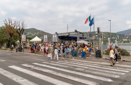 Photo for Como, Lombardy, Italy - September 5, 2022: Crowds of people queuing for ferry ticket office at the ticket office in Como on Lake Como. Lake Como navigation. - Royalty Free Image