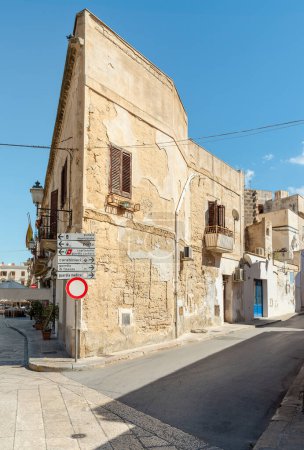 Photo for Favignana, Trapani, Italy - September 22, 2016: Urban street with typical mediterranean houses on the island Favignana in Sicily. - Royalty Free Image