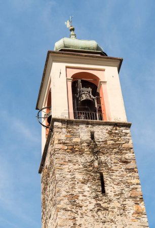 View of the bell tower of Church of Saints Peter and Paul (Santi Pietro e Paolo) in Vira Gambarogno, district of Locarno, Ticino, Switzerland.