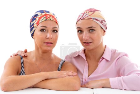 Photo for Portrait of two young women undergoing chemotherapy treatment. - Royalty Free Image