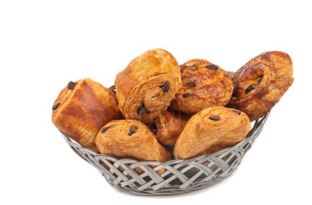 Mini pastries in a basket on a white background.