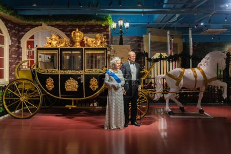 Photo for Shah Alam, Malaysia - April 17,2023 : Prince Philip, Duke of Edinburgh and Queen Elizabeth II's wax figures displayed at Red Carpet 2 in I-City Shah Alam. - Royalty Free Image