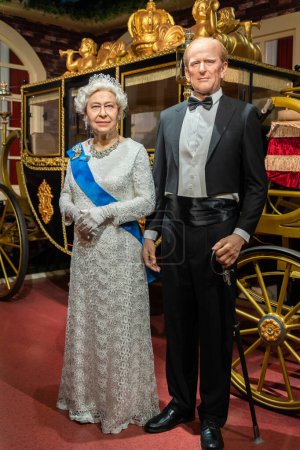 Photo for Shah Alam, Malaysia - April 17,2023 : Prince Philip, Duke of Edinburgh and Queen Elizabeth II's wax figures displayed at Red Carpet 2 in I-City Shah Alam. - Royalty Free Image
