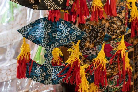 Colorful Wau kites for sale in the shop.