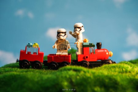 Photo for Bangkok, Thailand - October 3, 2022: Star Wars Lego Stormtroopers minifigures and red train against nature background. - Royalty Free Image