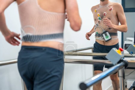 Photo for Man running while preforming a cardiovascular stress test in the hospital - Royalty Free Image