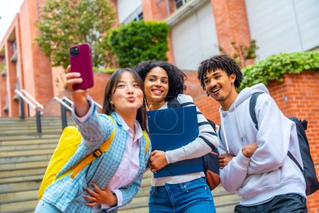 Photo for Three multi-ethnic friends taking a selfie in the campus of the university - Royalty Free Image