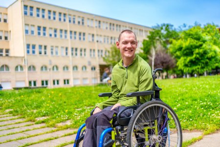Man with disability sitting in an electric wheelchair in the university campus