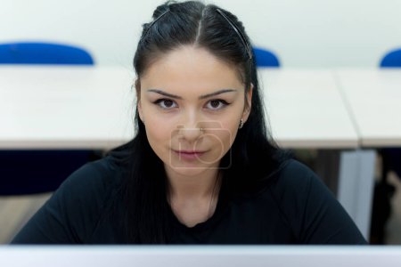 Photo for Young woman in programming school.Female student Learning In A Programing Class - Royalty Free Image