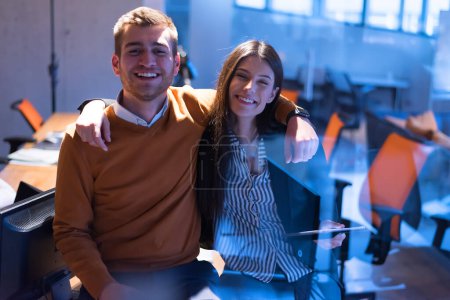 Photo for Business couple at modern office. Two programmers working on project late at night - Royalty Free Image