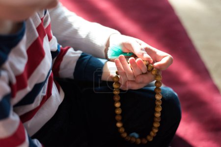 Photo for Islamic, community or people in praying with boy or kid for Gods support, spiritual peace during ramadan - Royalty Free Image