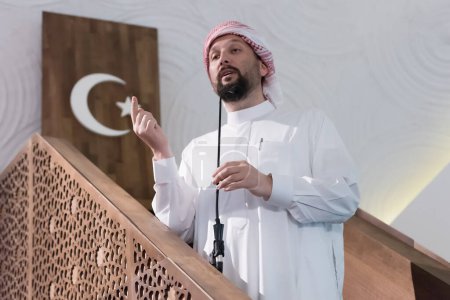 Photo for Muslim leader or imam speech sharing about islam during prayer time in the mosque - Royalty Free Image
