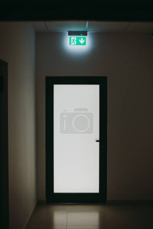 Photo for Empty room with door and exit sign - Royalty Free Image