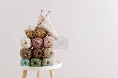 Photo for Natural wool in balls of various pastel colors on table. Copy space. - Royalty Free Image