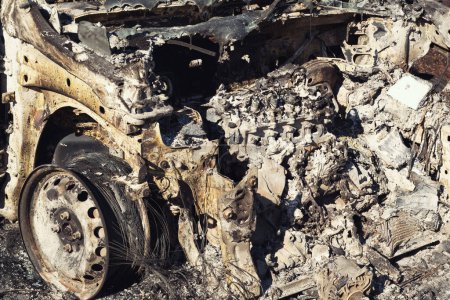 Photo for Izmir, Turkey - July 23, 2022: Close up shot of a Burnt car aftermath the forest fire at Derya Site Seferihisar Izmir Turkey. - Royalty Free Image
