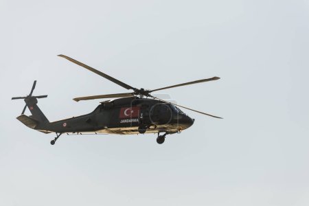 Photo for Izmir, Turkey - September 9, 2022: Close up shot of a Turkish gendarme helicopter on the sky on the liberty day of Izmir at Izmir Konak Turkey - Royalty Free Image