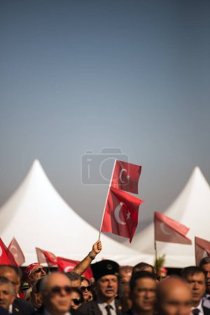 Photo for Izmir, Turkey - September 9, 2022: Close up shot of Turkish flags in a crowded people at the celebrations of liberation day Izmir Turkey at the Republic square. - Royalty Free Image