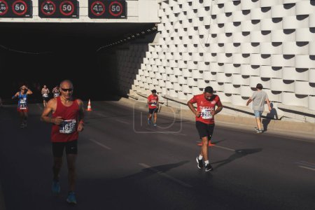 Photo for Izmir, Turkey - September 11, 2022: Competitors running in the half marathon are running special for the 100th anniversary of Izmir's liberation in Izmir Turkey. - Royalty Free Image