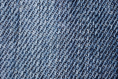 Foto de Primer plano de un fondo de textura de jeans de color azul. - Imagen libre de derechos