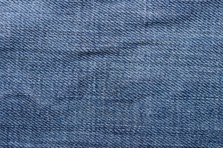 Foto de Primer plano de un fondo de textura de jeans de color azul. - Imagen libre de derechos