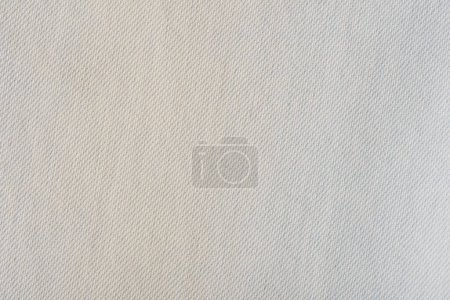Téléchargez les photos : Gros plan d'un fond de texture de jeans de couleur blanche. - en image libre de droit
