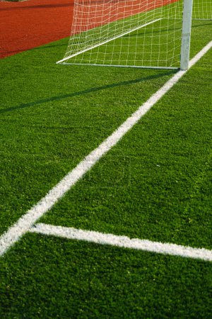 Téléchargez les photos : Close up shot of goal post with goal netting and goal line. - en image libre de droit