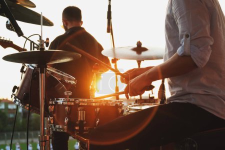 Téléchargez les photos : Close up shot of drum set and drummer on a concert. - en image libre de droit