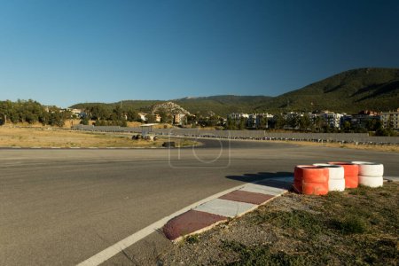 Photo for Road view of race track with some barrier tires. - Royalty Free Image