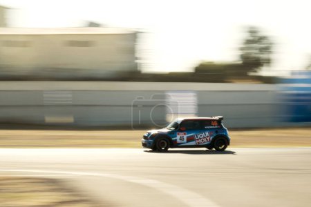 Photo for Izmir, Turkey - September 24, 2022: Fast going Blue colored Mini Cooper sports car on the road. - Royalty Free Image