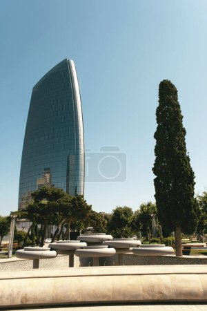 Photo for Baku, Azerbaijan - June 26, 2023: An early morning view of the towering building within the Crescent City Project, bathed in the soft light of sunrise - Royalty Free Image
