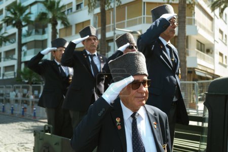 Photo for Izmir, Turkey - August 30, 2023: At Republic Square during the Victory Day celebrations, Turkish war veterans stand tall and salute from the bed of a military pickup, exemplifying national pride and respect - Royalty Free Image