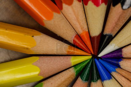 Photo for Vibrant colored pencils arranged in a circle, tips meeting in the center, showcasing a spectrum in a macro shot - Royalty Free Image