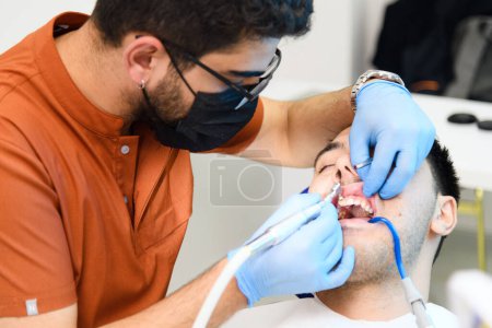 Photo for Expert dental whitening procedure in progress - Royalty Free Image