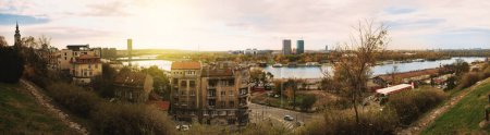 Photo for Belgrade, Serbia - December 2 2023: A panoramic view captures the tranquil flow of the Danube River from Kalemegdan Park, as the city transitions from day to dusk, with modern and historical elements coalescing in harmony - Royalty Free Image