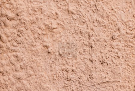 Téléchargez les photos : L'abstraction. Texture de ciment plâtré et peint mur en gros plan de couleur rose pâle - en image libre de droit