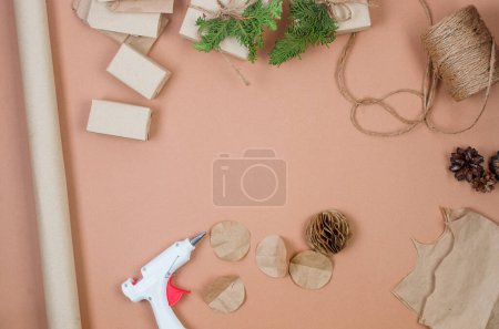 Photo for Process of making Christmas tree decorations from craftpaper and wrapping presents. Preparation for holidays. Concept budget savings, zero waste Winter decor holiday. - Royalty Free Image